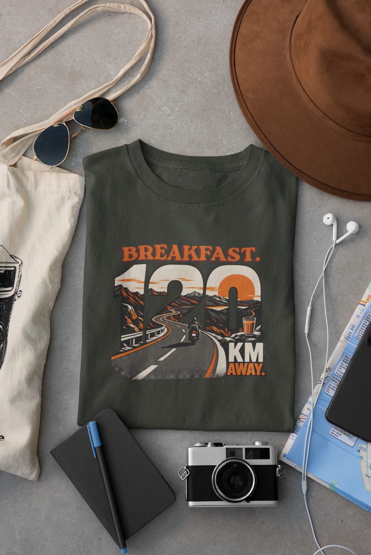 Olive Green Vipaniq classic T-shirt featuring the Breakfast 120 KM Away road and rider graphic on the front.