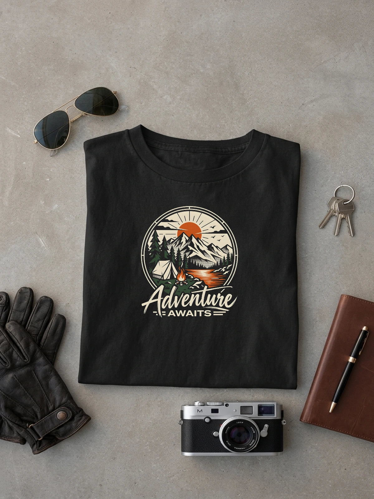 Adventure Awaits Black oversized T-shirt laid flat on studio canvas, full-scale 46.1% torso DTG print.