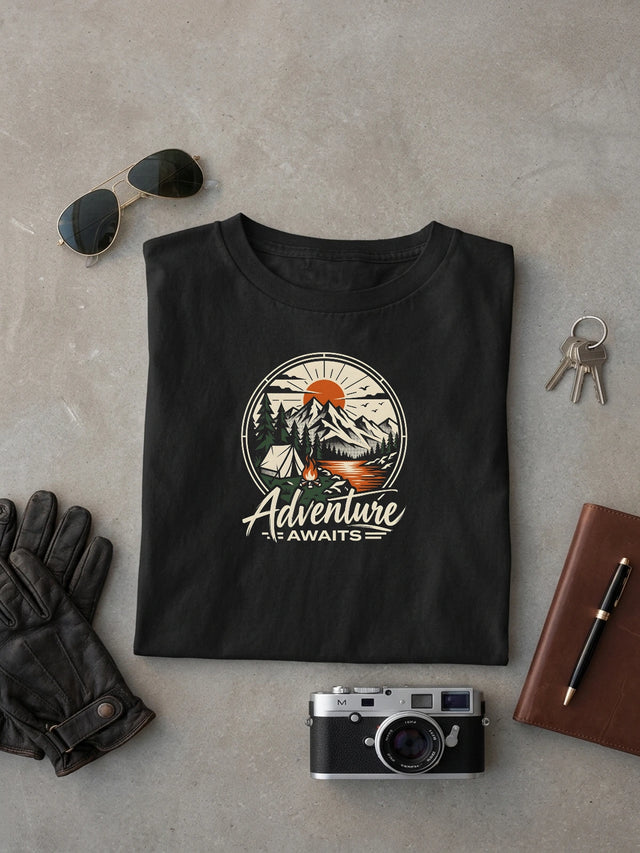 Adventure Awaits Black oversized T-shirt laid flat on studio canvas, full-scale 46.1% torso DTG print.