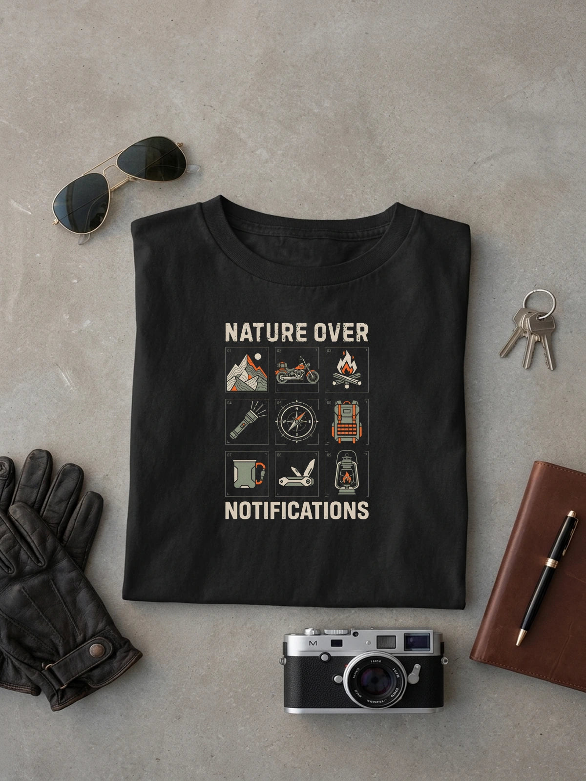 Nature Over Notifications Black oversized T-shirt laid flat on studio canvas, full-scale 43.7% torso DTG print.