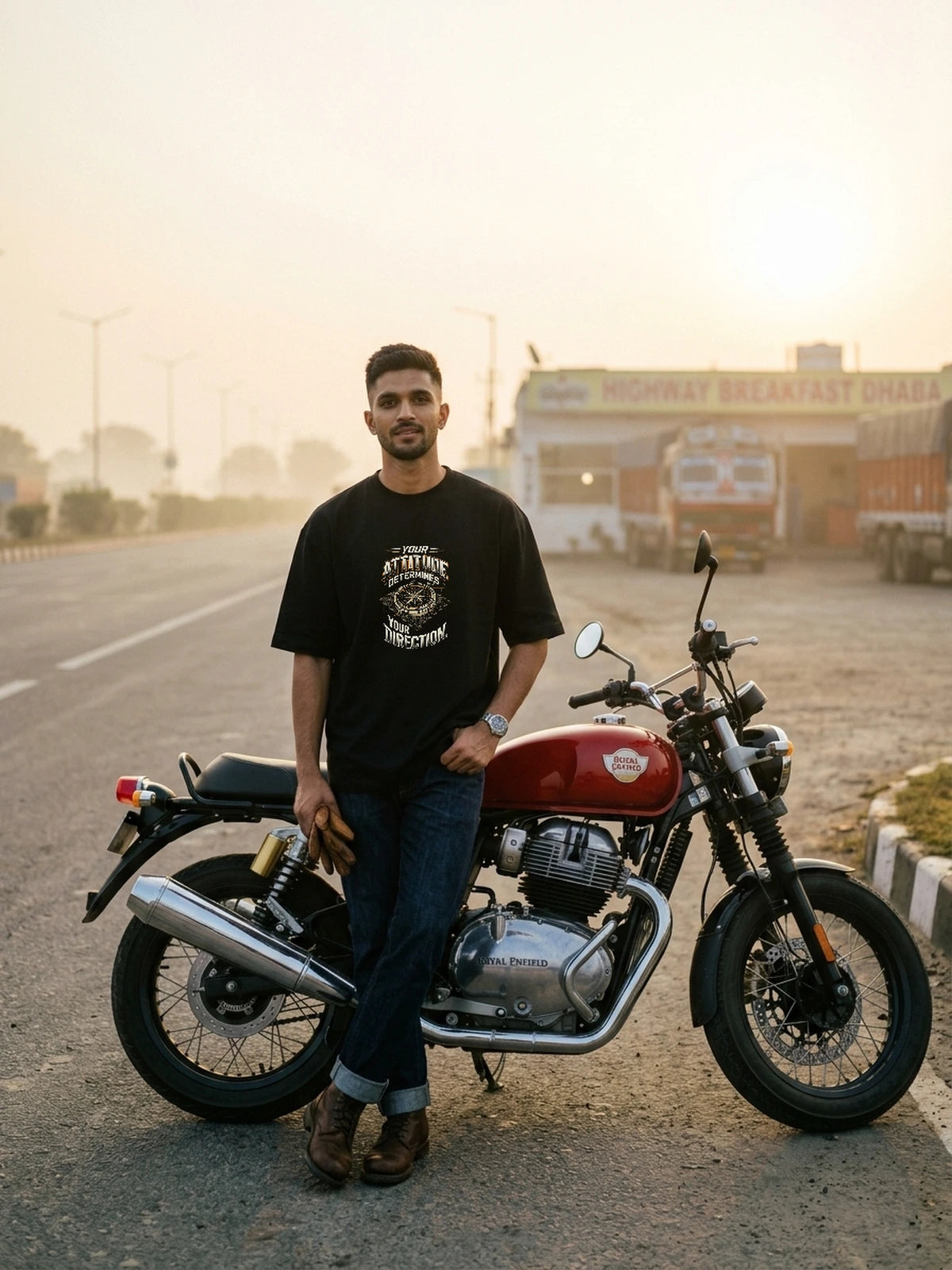 Rohan wearing Attitude Determines Direction oversized black T-shirt with proportionate 45.5% chest DTG print at dawn highway dhaba.